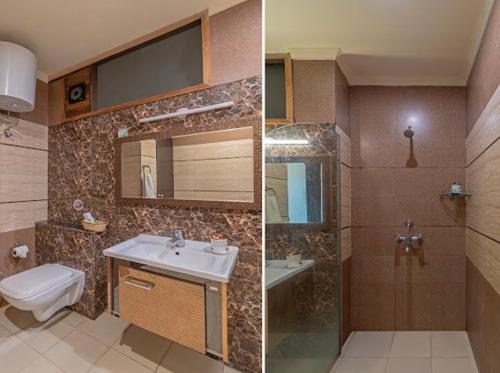 a bathroom with a sink and a toilet and a shower at Hotel Imperial Park in Gurgaon