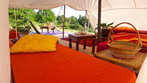 a bedroom with a bed and a tent at Tamana Tuquet Tentes Mauritannienne in Bergerac