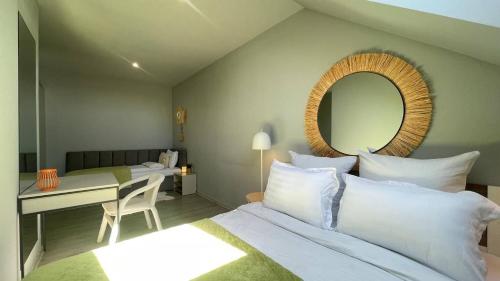 a bedroom with a bed with a mirror and a desk at Світлий номер для трьох осіб N9 in Chernivtsi