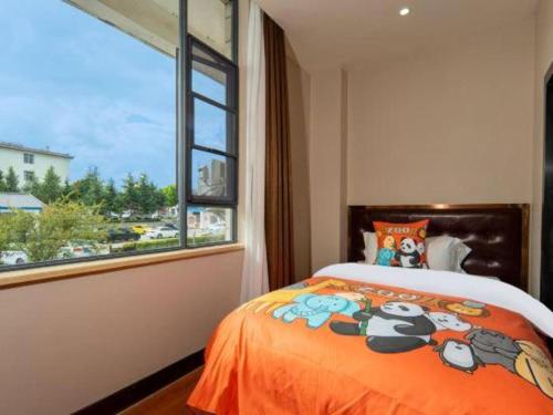 a bedroom with a bed and a large window at James Joyce Coffetel·Lijiang Old Town Centeral in Lijiang