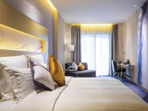 Katil atau katil-katil dalam bilik di NOVOTEL Jinji Lake Suzhou SIP