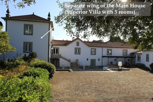 a large white building with a man house at Casa dos Macieis - Entire Main House, Entire Guesthouse or Separate Wing of Main House - Camino Santiago direct access & Optional Agritourism in Facha
