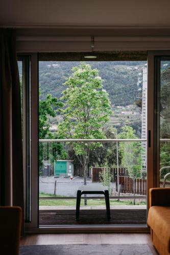 a window with a table in a room with a view at Welcome Douro - Eco Camping Resort in Cinfães