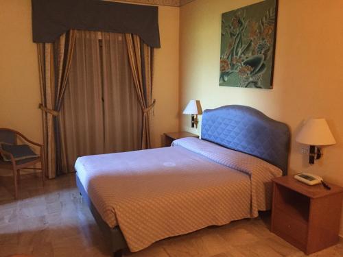 Letto o letti in una camera di Sunny Palace Hotel Restaurant