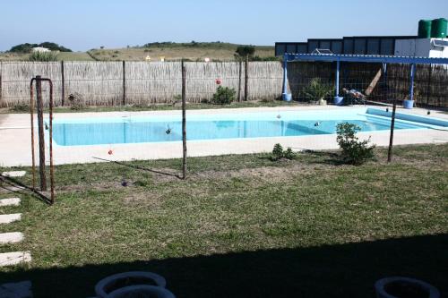 an empty swimming pool with a fence around it at Lala Kahle in Sodwana Bay