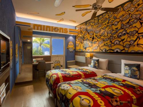 a hotel room with two beds and a desk at ibis Styles Goa Calangute - An Accor Brand in Calangute