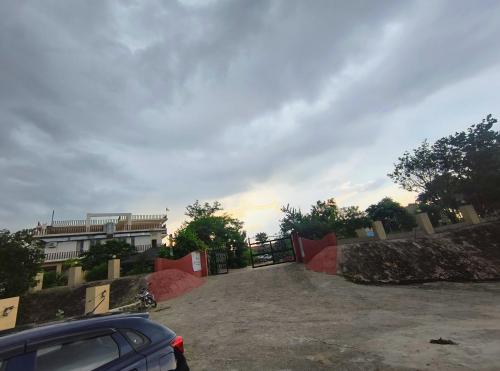 a car parked in a parking lot with a skateboard ramp at Jhar aravali in Jaipur