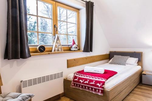 En eller flere senge i et værelse på Mountain Base - Domek Górska Oaza