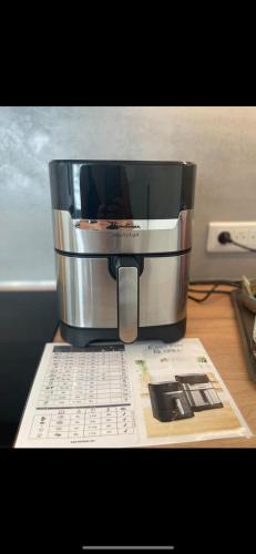 a coffee pot sitting on top of a table at Appartement T2 calme à Illkirch avec parking privé in Illkirch-Graffenstaden
