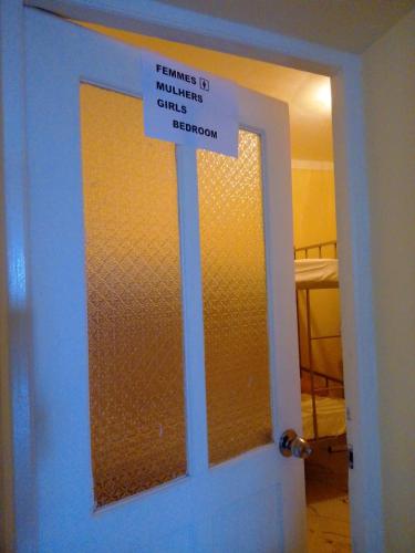 a sign on the door of a room at NO CASH ACCEPTED-MEETING POINT-Volcanic Beach Refuge-Group Housing in São Filipe