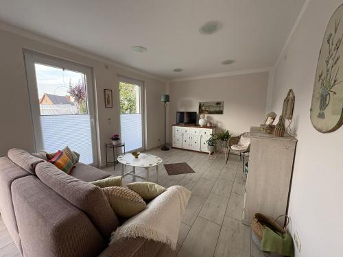 a living room with a couch and a table at Casa mia in Magdeburg