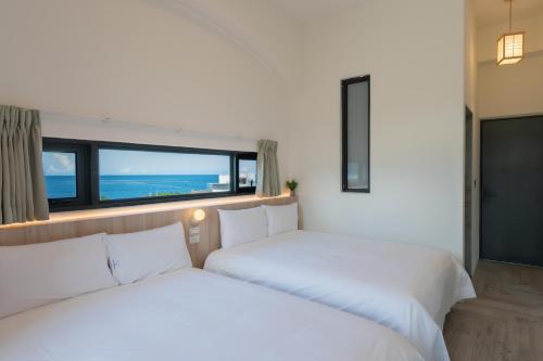 Cama o camas de una habitación en 冉冉七星潭海景民宿