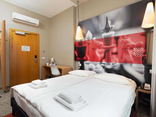 Postel nebo postele na pokoji v ubytování Ibis Riga Centre