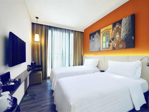 Mercure Singapore Bugisにあるテレビまたはエンターテインメントセンター