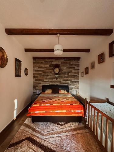 a bedroom with a bed and a brick wall at Apartments "Old house Mustafic" in Bar