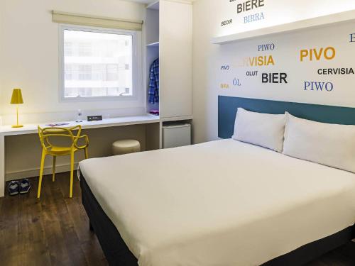 Ένα ή περισσότερα κρεβάτια σε δωμάτιο στο ibis Styles Ribeirao Preto Jardim Botanico