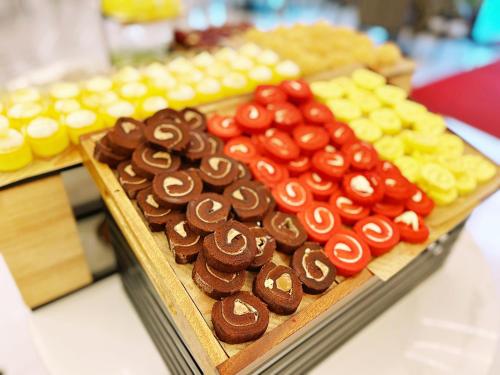 a display of different types of chocolates on a table at Magnotel Guilin Elephant Trunk Hill in Guilin