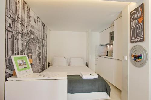 Кровать или кровати в номере BmyGuest - Alfama Boutique Apartment