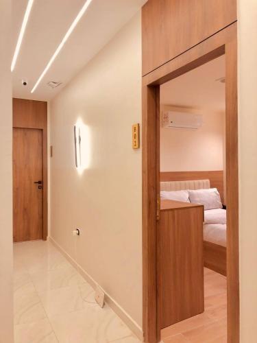 a bedroom with a door leading to a bed at Pyramids INN View in Cairo