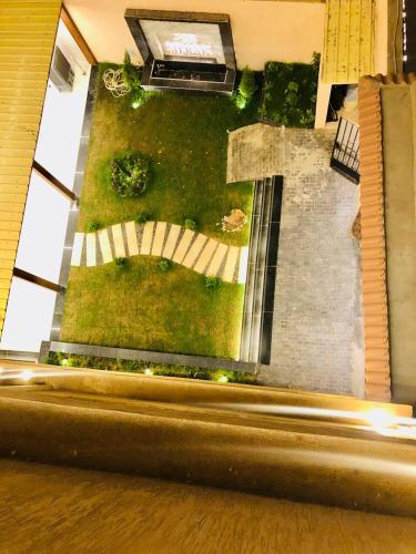 an aerial view of a garden from a building at Pyramids INN View in Cairo