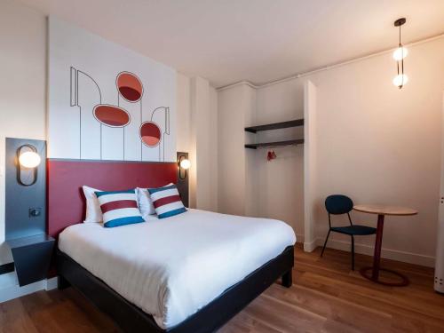 Ένα ή περισσότερα κρεβάτια σε δωμάτιο στο Ibis Styles Rouen Centre Cathédrale
