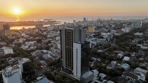 an aerial view of a city at sunset at Hakuna Stays in Makassar