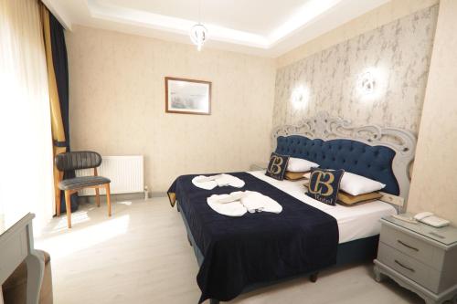 Postel nebo postele na pokoji v ubytování BALPETEK HOTEL