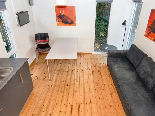 a living room with a couch and a table at Aabenraa Camping in Aabenraa