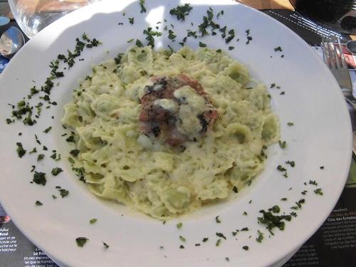a plate of food with pasta on a table at Domaine de la Provençale in Saint-Didier-de-la-Tour