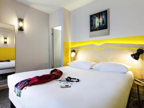 Ένα ή περισσότερα κρεβάτια σε δωμάτιο στο ibis Styles Paris Nation Porte De Montreuil