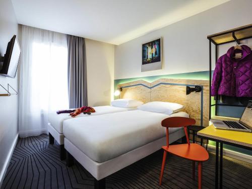 Ένα ή περισσότερα κρεβάτια σε δωμάτιο στο ibis Styles Paris Nation Porte De Montreuil