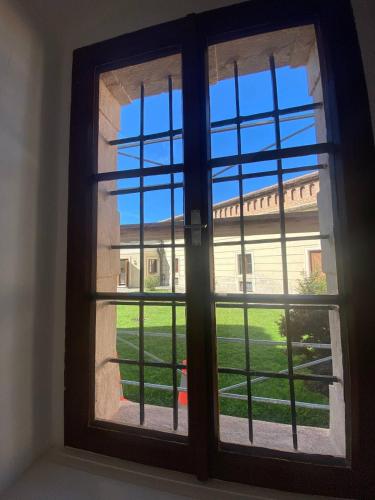 a window with a view of a building at Gästehaus Benediktinerstift Göttweig - Bed & Breakfast Monastery in Furth