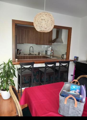 a kitchen with a table with a lunch box on it at Andorre Ordino Arcalis Fizu in El Serrat
