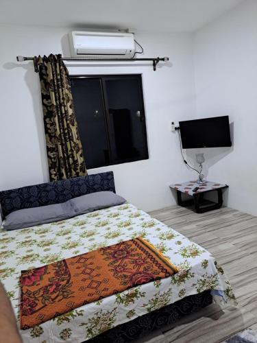 Postelja oz. postelje v sobi nastanitve Nav's B&B