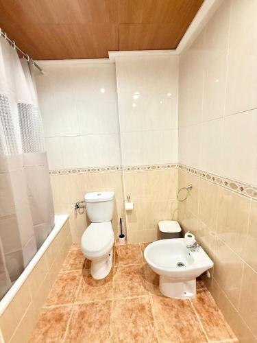 Ένα μπάνιο στο On Punta Prima AMCH Hospedaje