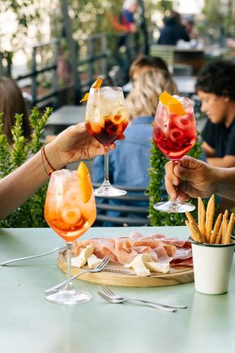 a group of people holding up wine glasses at Appartamenti Borgo Piazza in Cocconato