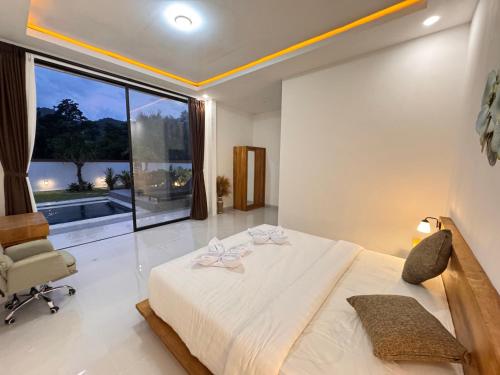 Postel nebo postele na pokoji v ubytování Maha Ritz private villa
