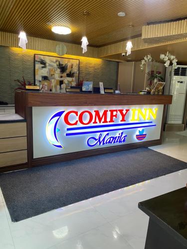 a company in miami sign on a counter in a store at Comfy Inn Manila-Kalaw in Manila