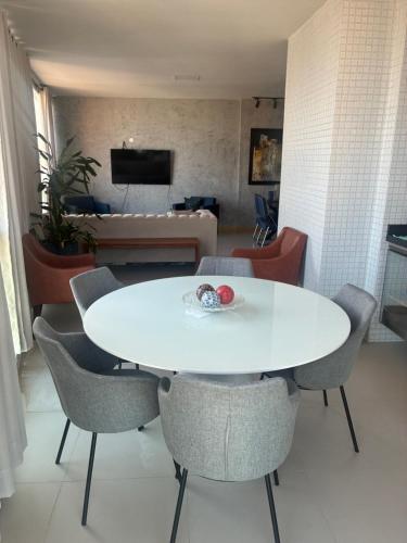 a white table and chairs in a living room at Luxury Apartment COP 30 in Belém