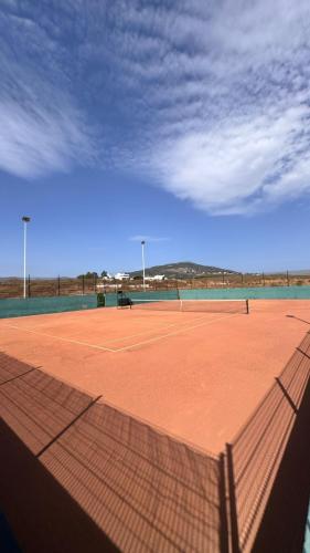 a tennis court with a net on top of it at Apartment in Colina Smir Mdiq in M'diq