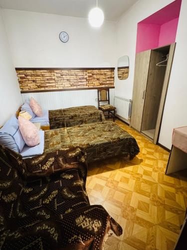 a bedroom with two beds in a room at Lovely Goris in Goris