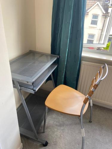 a desk and a chair in a room with a window at Double room to rent near Royal Berkshire Hospital and University of Reading in Reading