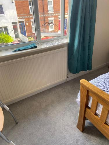 a room with a radiator and a window at Double room to rent near Royal Berkshire Hospital and University of Reading in Reading