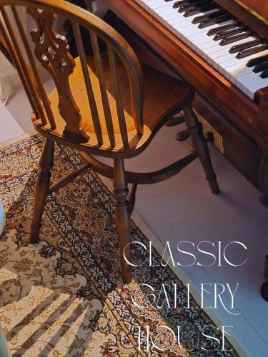 a wooden chair sitting in front of a piano at Achasan Mountain's Green Forest Han River View a classic 3-room gallery house full of emotions in Seoul