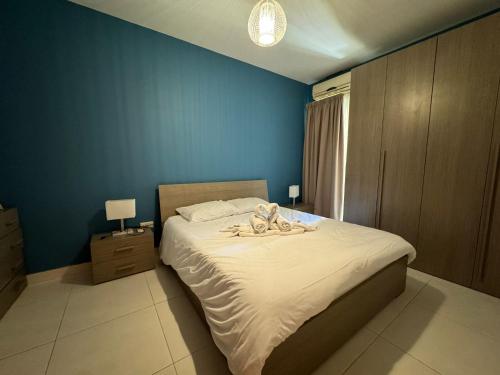 Ένα ή περισσότερα κρεβάτια σε δωμάτιο στο Bayview Seafront 5A