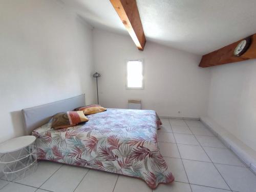 En eller flere senge i et værelse på Maison au bord de mer