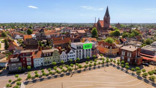 an aerial view of a city with a church at FeWo Maximilian & Viktoria in Barth