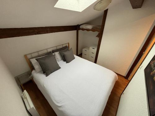 an overhead view of a bed in a room at Sky High Family Apartment in Orelle