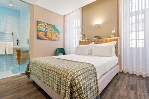 Un ou plusieurs lits dans un hébergement de l'établissement Jardim da Batalha Boutique Hotel by Shiadu