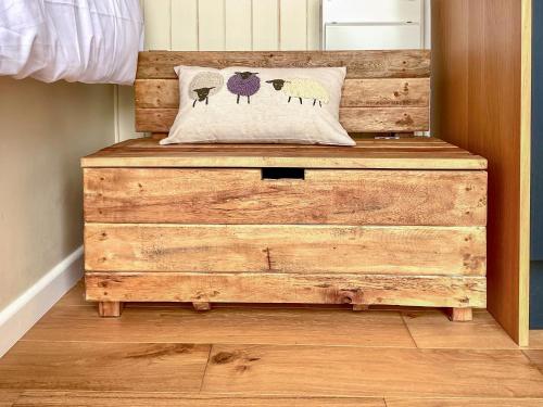 a wooden dresser with a pillow on top of it at Walkeridge Farm in Reading